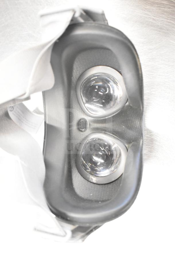 Two Oculus MH-A64 VR headsets, slightly used, pristine lens condition, adjustable straps, ready for immersive experiences.