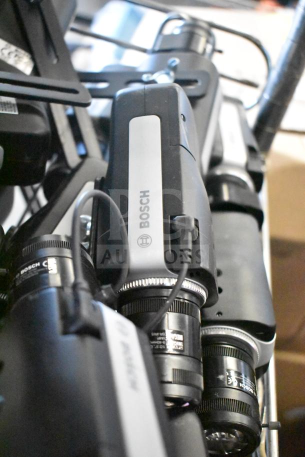 Bosch NBN-50022-C-W security network camera, black and silver, labeled, with attached lens, excellent condition.