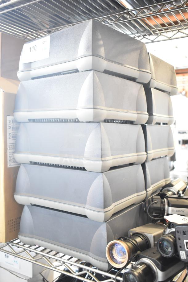 10 Sensormatic AMB-9010-IPS Label Deactivator Controllers stacked on a shelf, each in excellent condition.