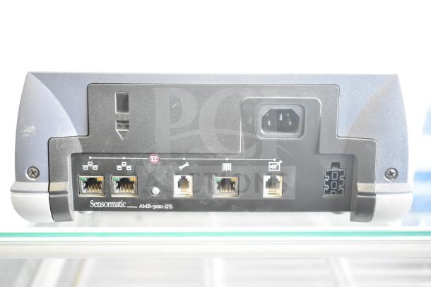 Sensormatic AMB-9010-IPS label deactivator controller unit, rear view with various connection ports and power input.