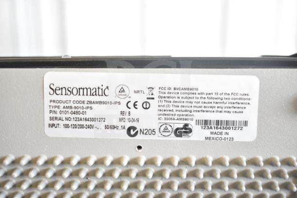 Sensormatic AMB-9010-IPS Label Deactivator Controller, detailed view of label, model and input specs shown.
