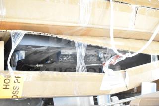 Boxed camera and 32" monitor in cardboard packaging, visible cables and foam padding. Condition unknown. Auction lot.