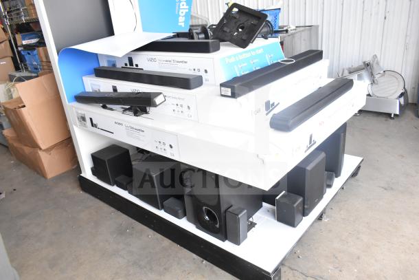 Speaker store display featuring Samsung, LG, Bose, Hisense, TCL, Vizio sound bars and speakers in used condition.