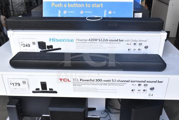 Speaker store display featuring Samsung, LG, Bose, Hisense 420W 5.1.2ch sound bar, TCL 300W 5.1 channel sound bar, and Vizio sound bars with labels.