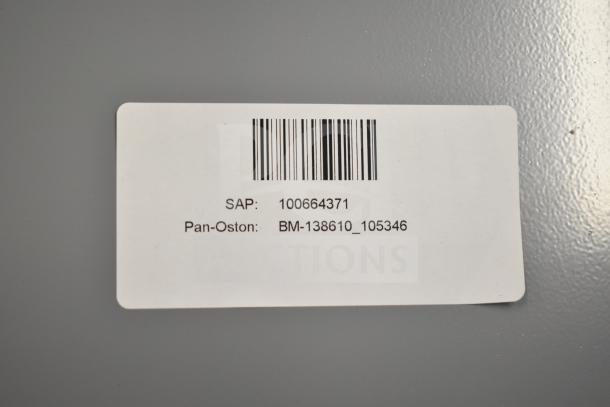 Barcode label showing SAP: 100664371, Pan-Oston model BM-138610_105346, on a new scratch and dent RX printer stand.