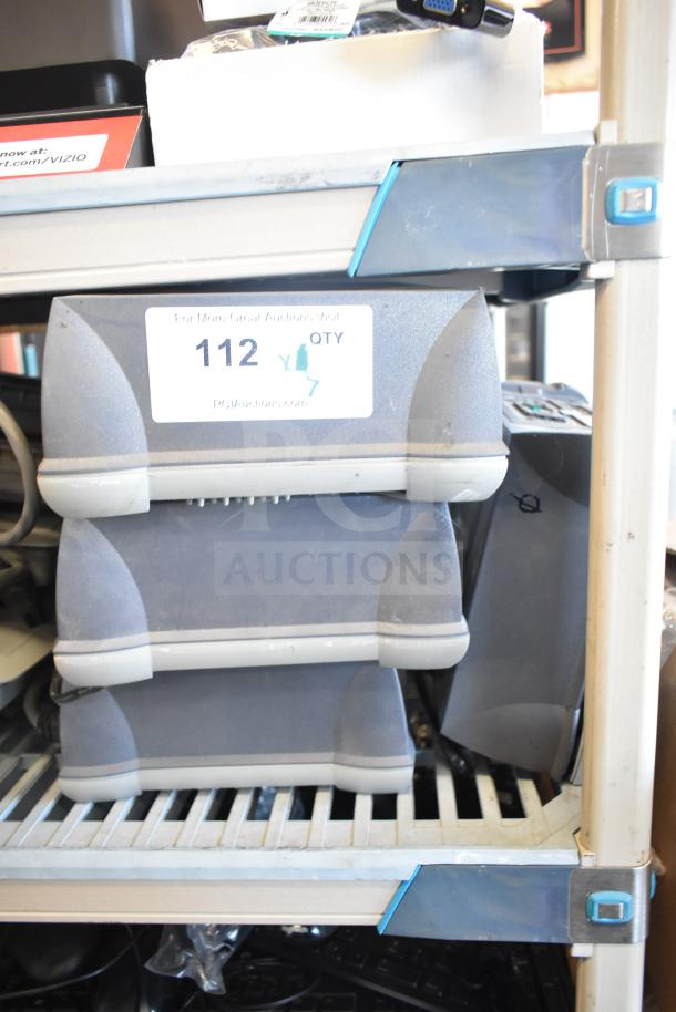 7 Sensormatic ZBSMPROE Antenna Deactivators on a shelf, gray casing, model visible, used condition, lot qty 7.