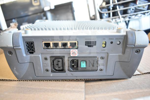 Sensormatic ZBSMPROE Antenna Deactivator, rear ports and connections visible, gray casing, used condition.