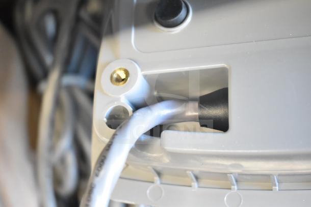 Sensormatic ZBSMPCPEF Compact Pad Pro connector close-up, showing cable and port detail in good condition.