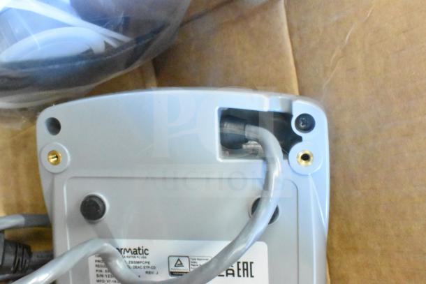 Sensormatic ZBSMPCPE Compact Pad PRO with visible cables and label, included in a lot with various security devices.