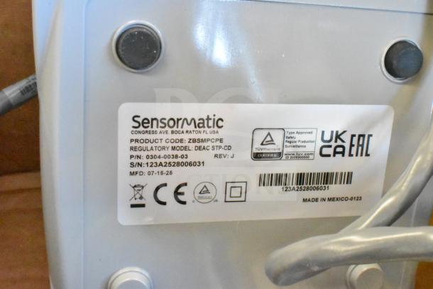 Sensormatic ZBSMPCPE label with product details, regulatory model DEAC STP-CD, serial 123A2528006031, made in Mexico.
