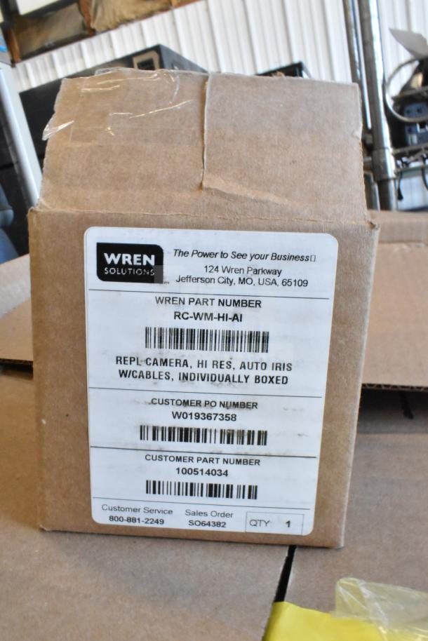 Cardboard box displaying Wren Solution label, listing part number, REPL-CAMERA, and customer information.