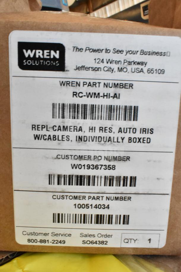 Wren camera boxed with label showing part number RC-WM-HI-AI, high-res, auto iris, includes cables.