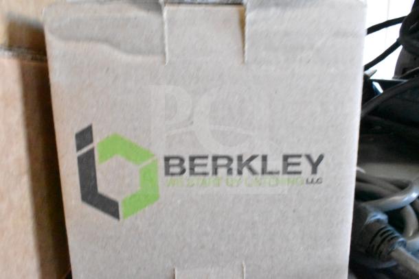 Cardboard box with Berkley logo, containing part of a 12-item lot including Sensormatic and Wren devices.