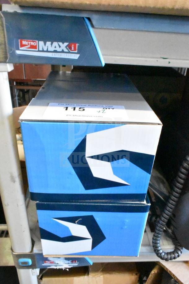 Two Scorpion 720029-B tool-less convertible laptop security devices in retail packaging on a shelf.