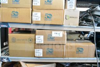 Boxes containing 8 Sensormatic security devices, including ZBAMB9010-IPS deactivator, ZBAMB9012 label antenna, and ZBSMPCPE compact pad, shown on warehouse shelving.