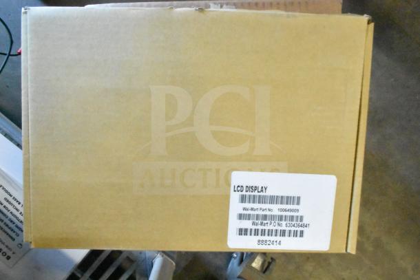 Cardboard box with label showing "LCD Display," Wal-Mart Part No. 100649009, and P.O. No. 6304364841.