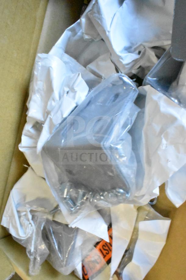 Box with Sensormatic ZBAMB9010-IPS controller, ZBAMB9012 antenna, ZBSMPCPE tabletop antenna; new, with protective packaging.