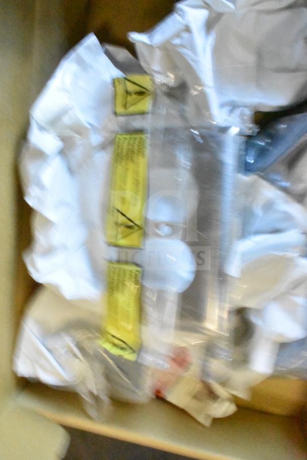 A box containing Sensormatic equipment components such as ZBAMB9010-IPS Deactivator Controller and ZBAMB9012 Antenna, wrapped in protective packaging.