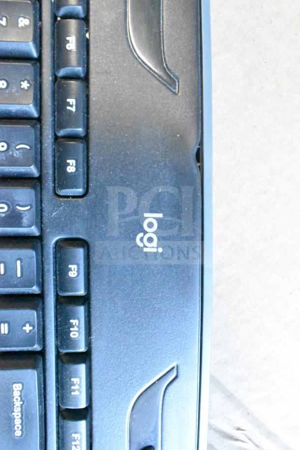 Lot of various tech items featuring a Logitech keyboard, visible F6-F12 keys, in used condition.