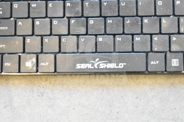 Seal Shield computer keyboard, showing brand logo. Condition appears used with visible wear on the keys.