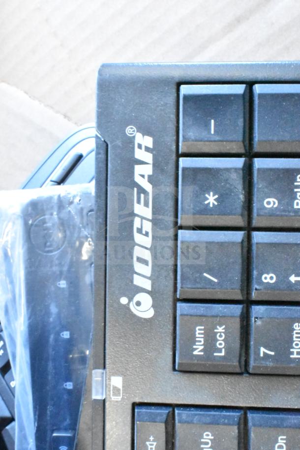 IOGEAR keyboard close-up, visible numpad keys, part of lot with various items. Includes keyboard, mouse, and more.