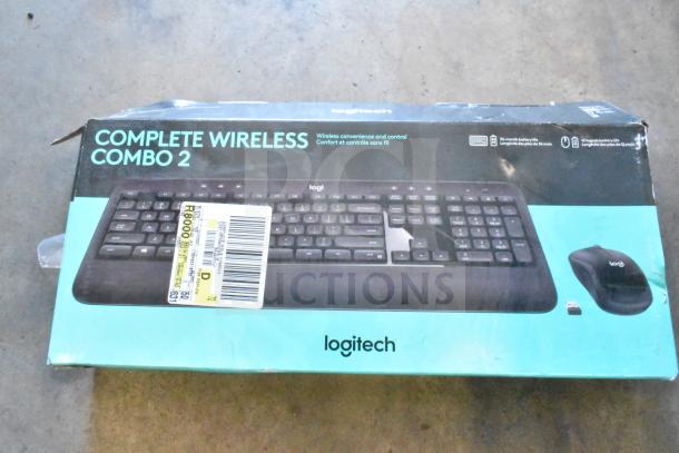 Logitech Complete Wireless Combo 2 set in box, includes keyboard and mouse. Box shows wear. 36-month battery life.