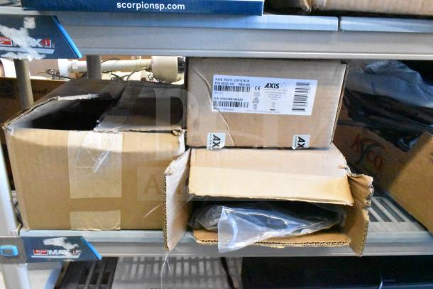 Three items including Axis T8311 Joystick with label, Sensormatic Cable in sealed boxes, indicating new condition.