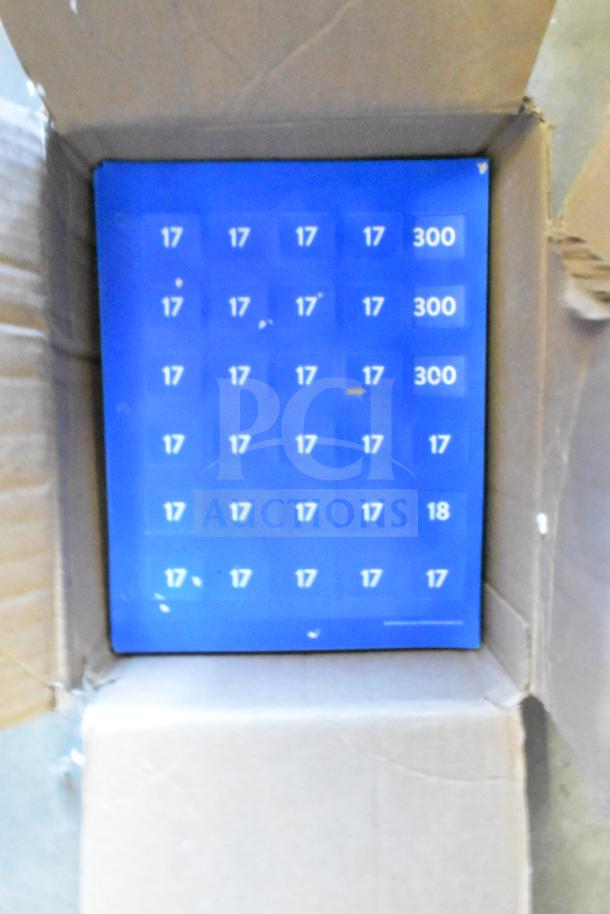 Blurred image of a blue panel inside a cardboard box, unrelated to the listed auction items.