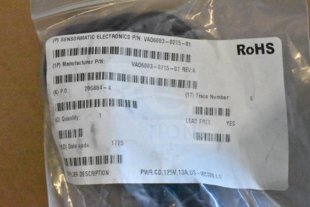 Close-up of a Sensormatic cable in packaging with RoHS label and specifications, part number VAD6003-0215-01.