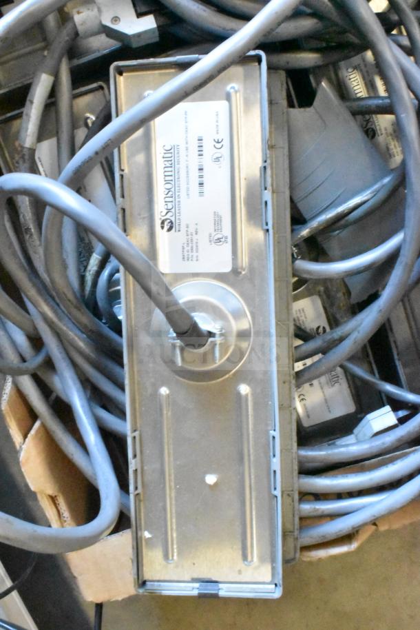 Sensormatic ZBSTPSP-L unit with multiple cables, metal casing, clear label. Used condition. Auction lot of 7 items.