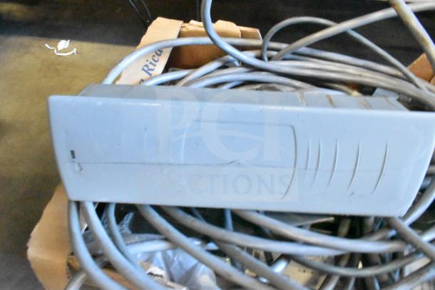 Assorted items including Sensormatic ZBSTPSP-L unit with cables. Used condition, potential value in quantity bid.