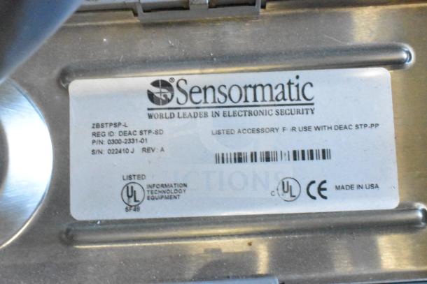 Sensormatic ZBSTPSP-L unit, labeled with model, serial numbers, and UL certification. Includes various cables.