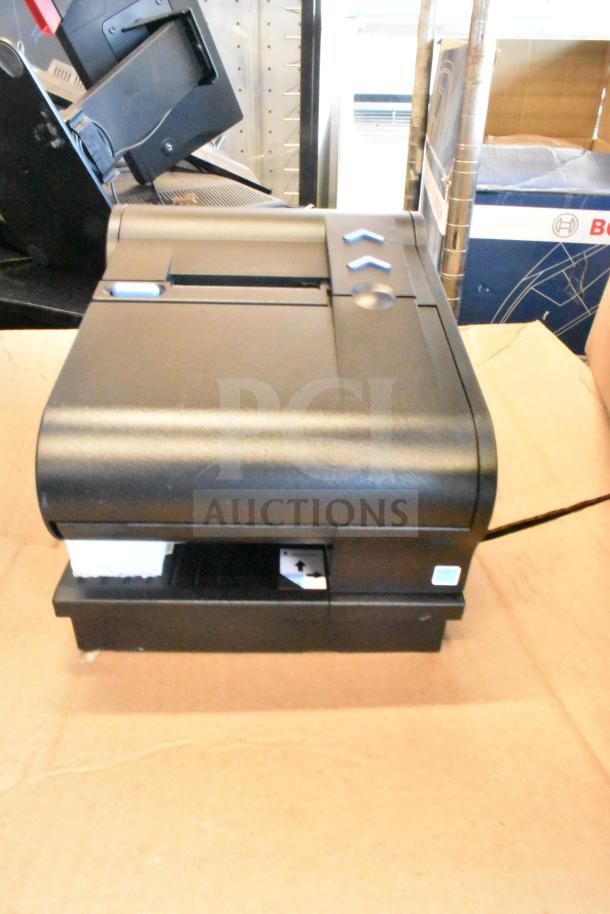Toshiba 6145-2TC receipt printer, black, good condition, with visible button controls and indicator symbols.