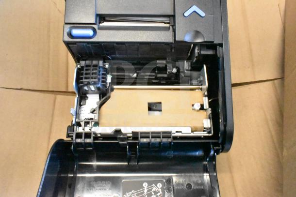 Toshiba 6145-2TC receipt printer, open lid showing internal components, black plastic case, appears in good condition.