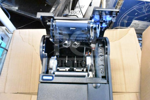 Toshiba 6145-2TC receipt printer with open cover, showing interior components and rollers; appears in functional condition.