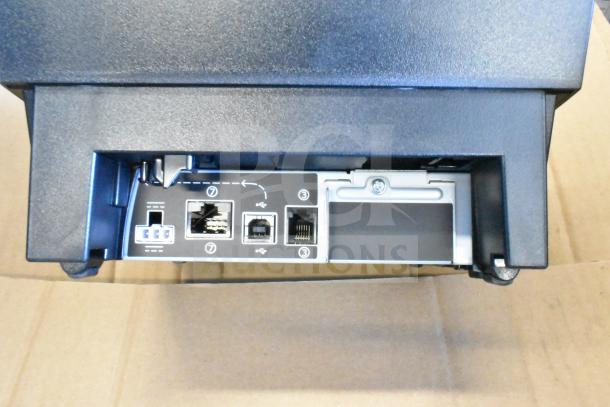 Toshiba 6145-2TC receipt printer, black, rear panel view showing multiple connection ports, in good condition.
