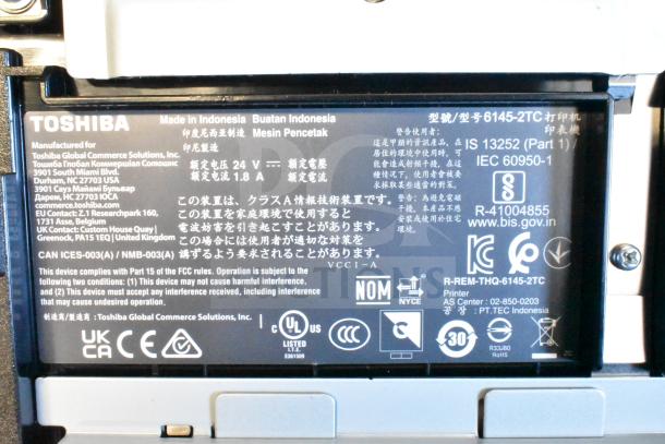 Toshiba 6145-2TC Receipt Printer, made in Indonesia. Features compliance labels and FCC information on the back panel.