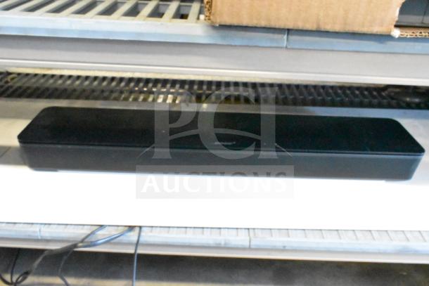 Bose Sound Bar in black, rectangular shape, used condition, includes visible power cable.