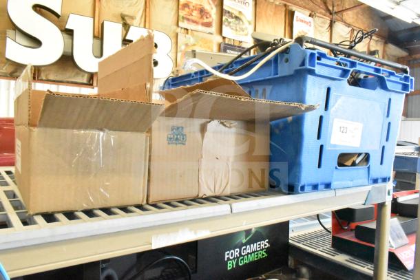 Tier lot with Sensormatic ZBAMB9012 Label Deactivator Pad and computer keyboards. Includes cardboard and blue plastic boxes.