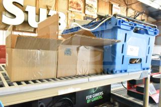 Tier lot with Sensormatic ZBAMB9012 Label Deactivator Pad and computer keyboards. Includes cardboard and blue plastic boxes.