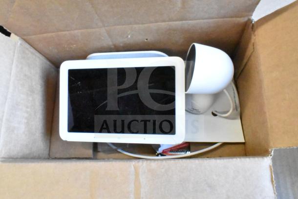 Box containing a Sensormatic ZBAMB9012 label deactivator pad and miscellaneous electronics, including computer keyboards.