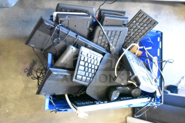 Tiered lot with Sensormatic ZBAMB9012 label deactivator pad and multiple computer keyboards, assorted condition.