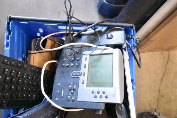 Tier lot of various items in a blue bin, including a Sensormatic ZBAMB9012 label deactivator, computer keyboards, and cables.