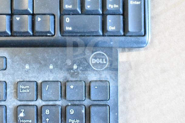 Dell keyboard, used condition, part of a tier lot including Sensormatic ZBAMB9012 label deactivator pad.