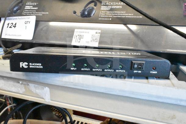 Blackweb HDMI splitter BWA17AV015 with 4 outputs, input indicator lights, and on/off switch, in used condition.