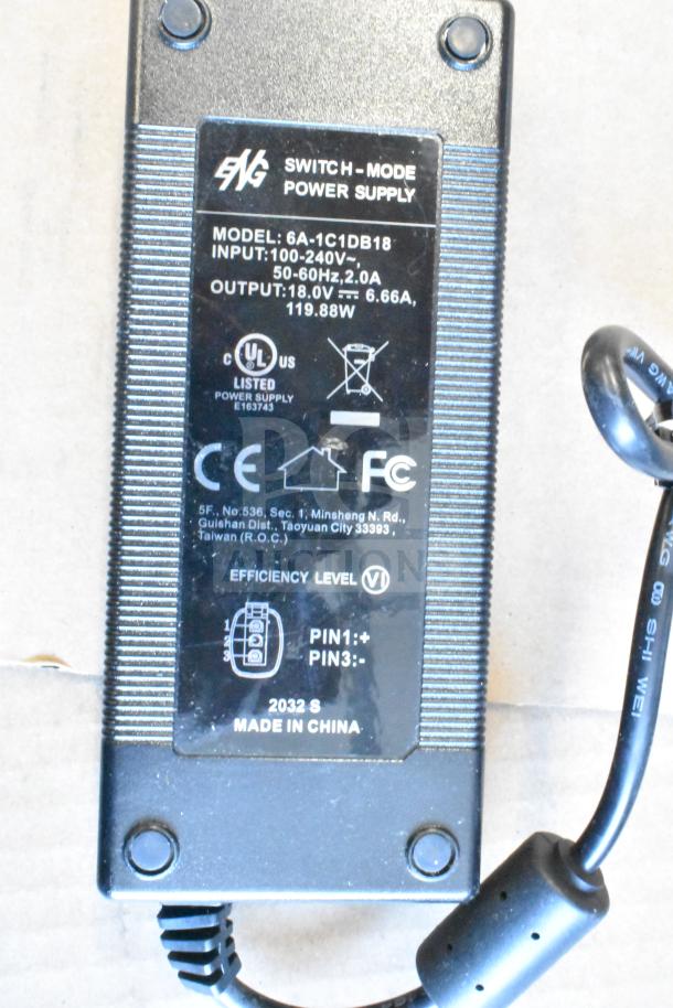 Switch-mode power supply, model 6A-1C1DB18, input 100-240V, output 18.0V, UL listed, made in China.