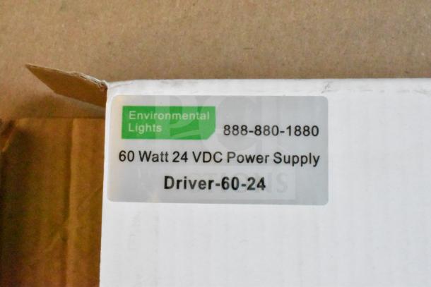 Lot of various items including an Environmental Lights 60W 24VDC power supply, model Driver-60-24. Perfect for tech setups.