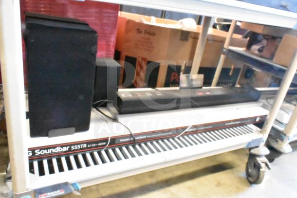 LG store display featuring Soundbar S55TR and speaker, in good condition. Includes visible labels and packaging.