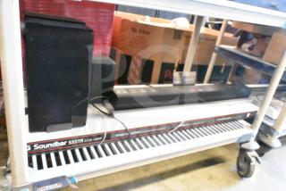 LG store display featuring Soundbar S55TR and speaker, in good condition. Includes visible labels and packaging.
