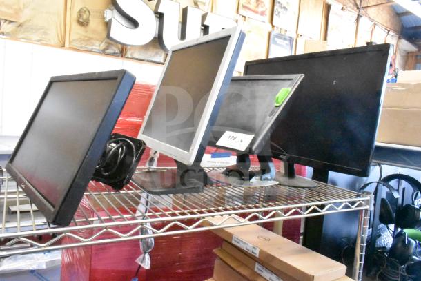 Four monitors on a shelf: Costar, HP Compaq LE1711, Elo TouchSystems, Acer S240HL. Includes visible model tag.